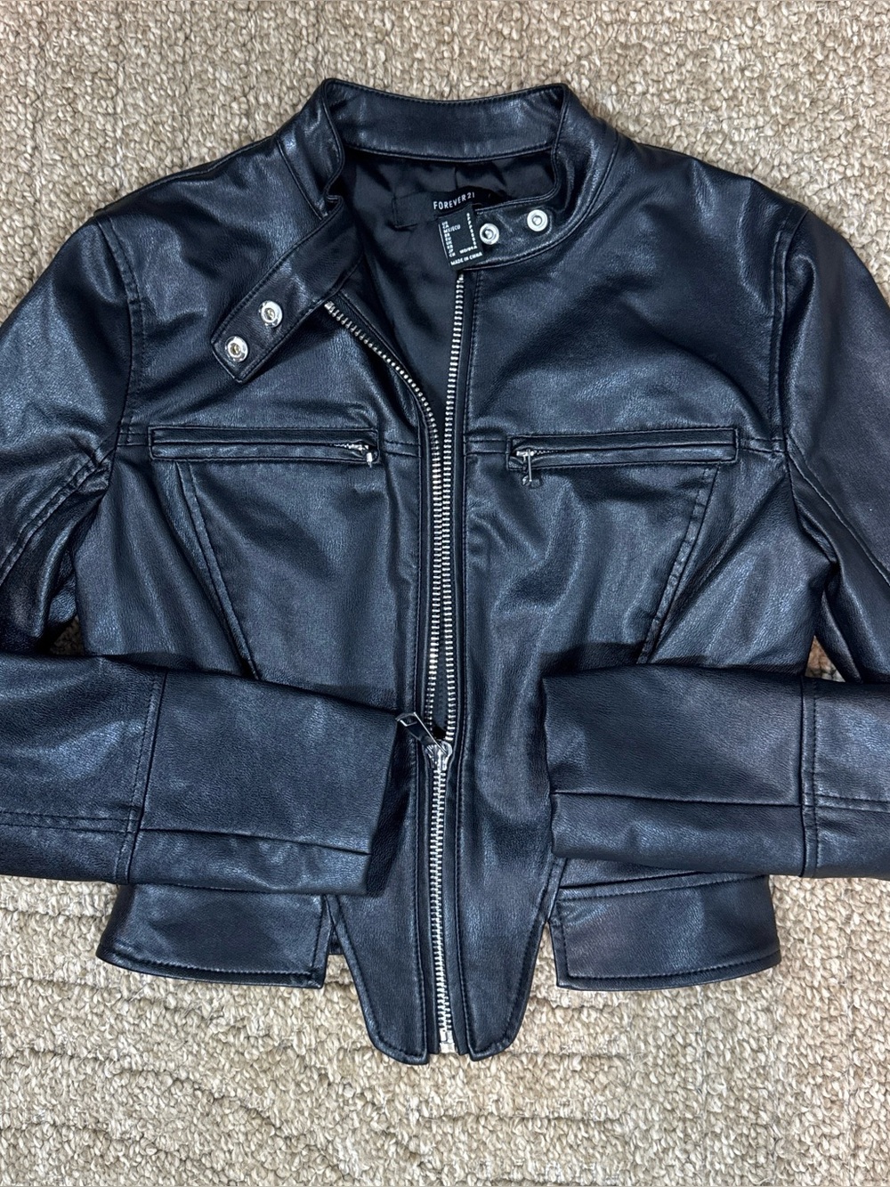 ✨ Level up your wardrobe with this edgy, head-turning, slick black faux leather